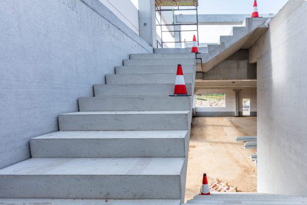 Warehouse stairs construction. Building a new industrial hall or storehouse